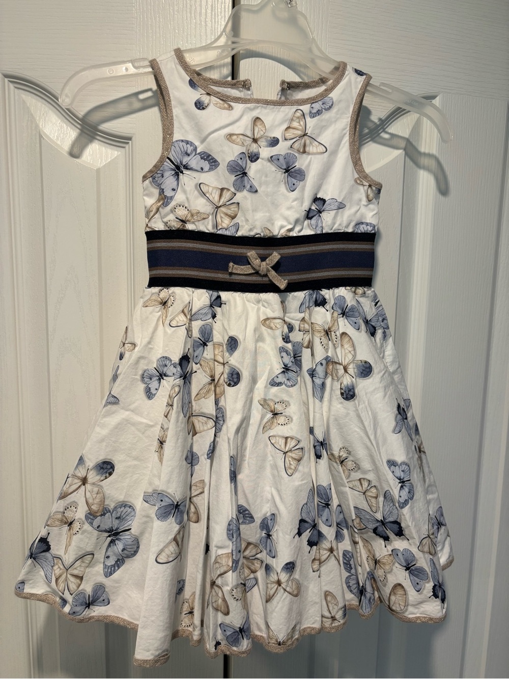 MonnaLisa White Butterfly Print Dress with Navy Waistband and Gold Trim